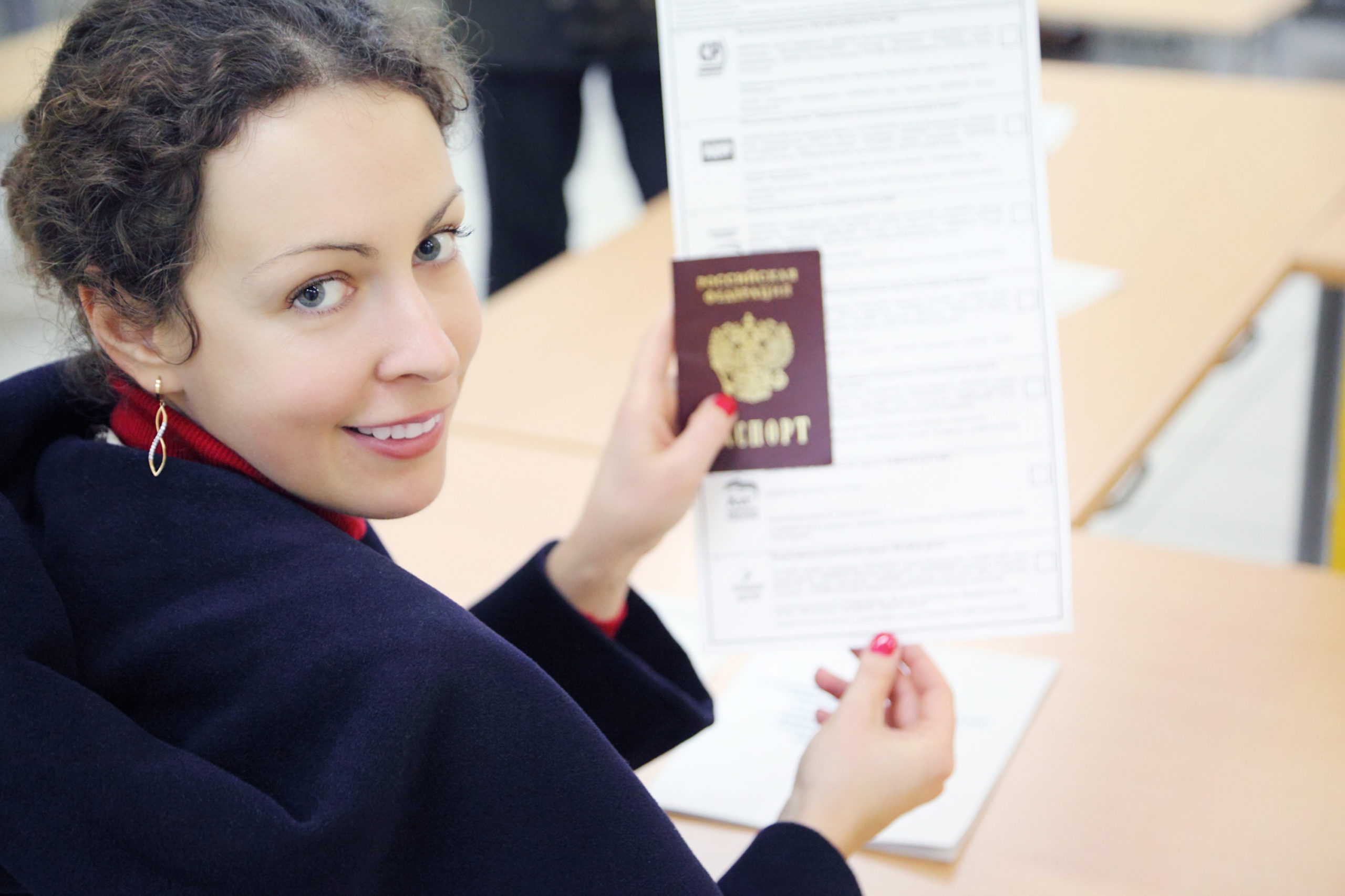 Woman shows passport 